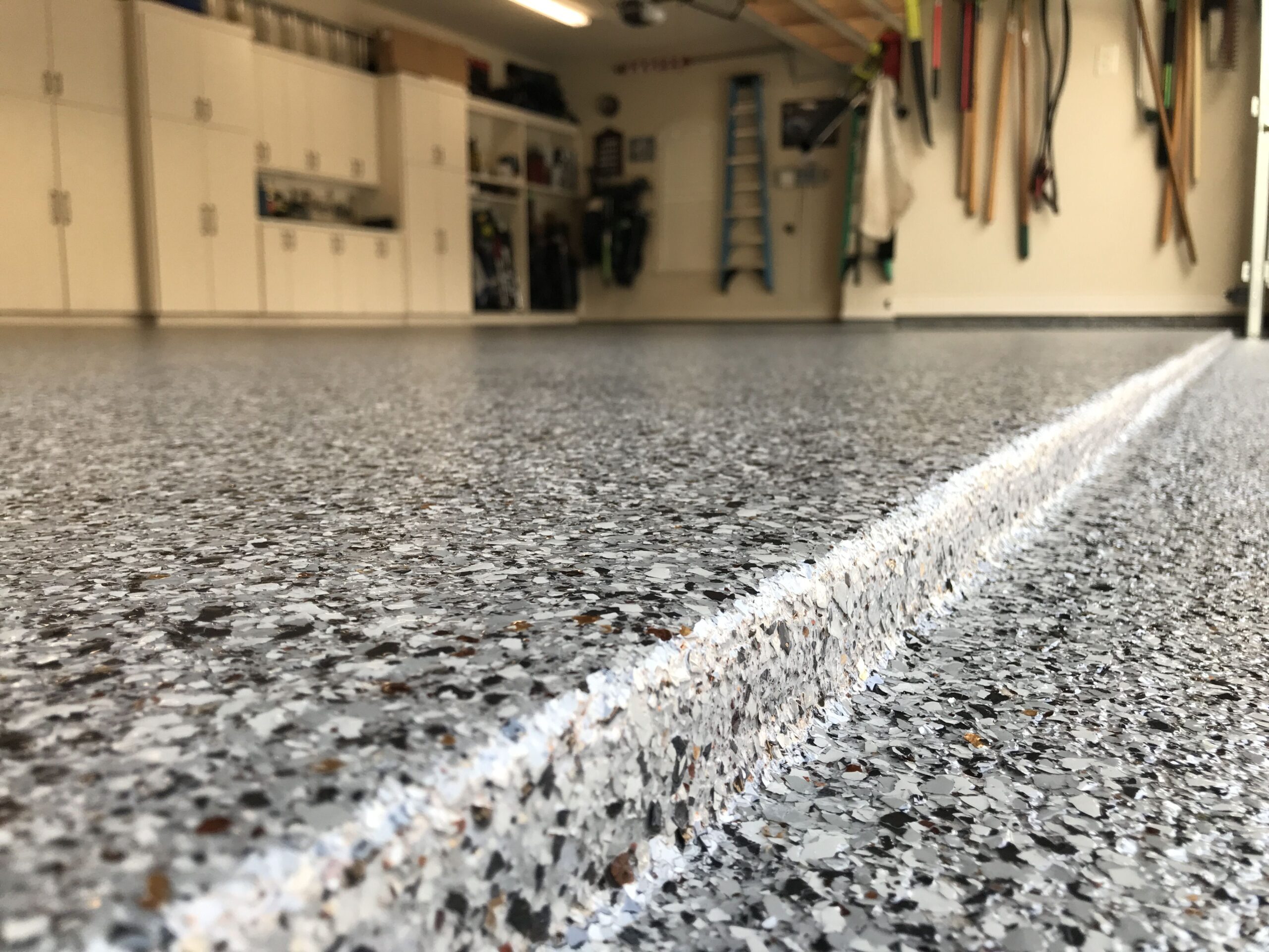 Polyaspartic vs. Epoxy: Which Garage Floor Coating Lasts Longer?